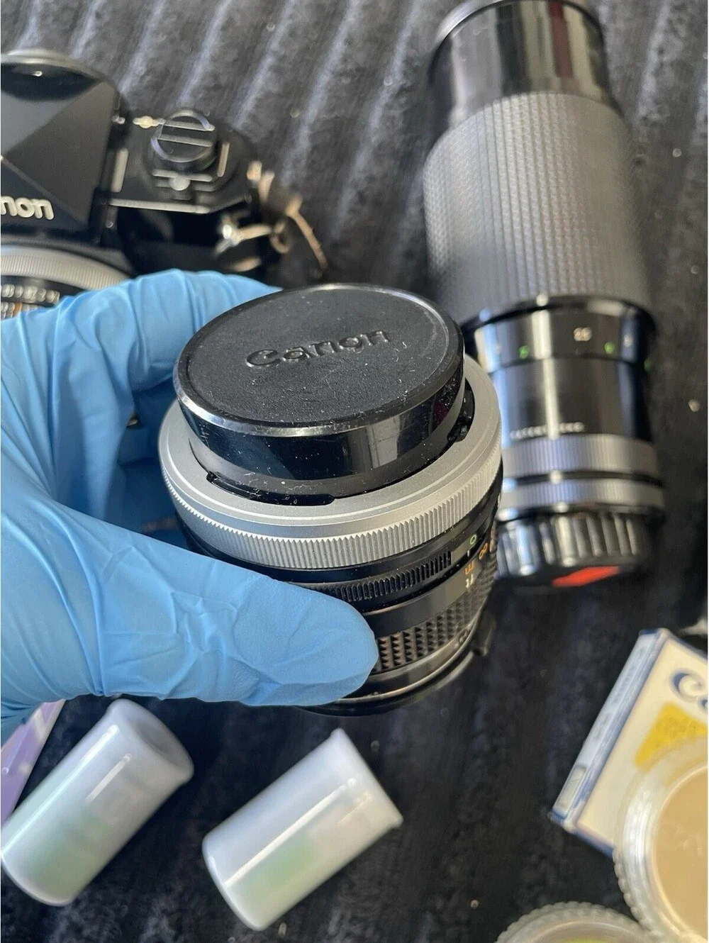 CANON F-1 FILM CAMERA WITH LENSES, CASE, FILM AND MORE  *TESTED, READ DESC*